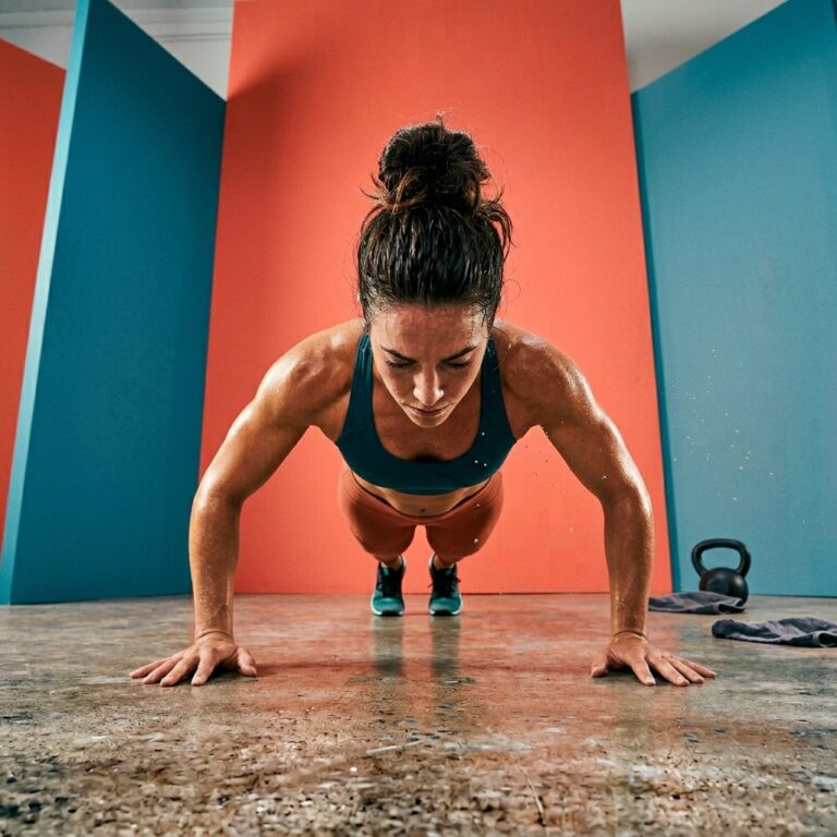 Woman working hard during a home strength workout