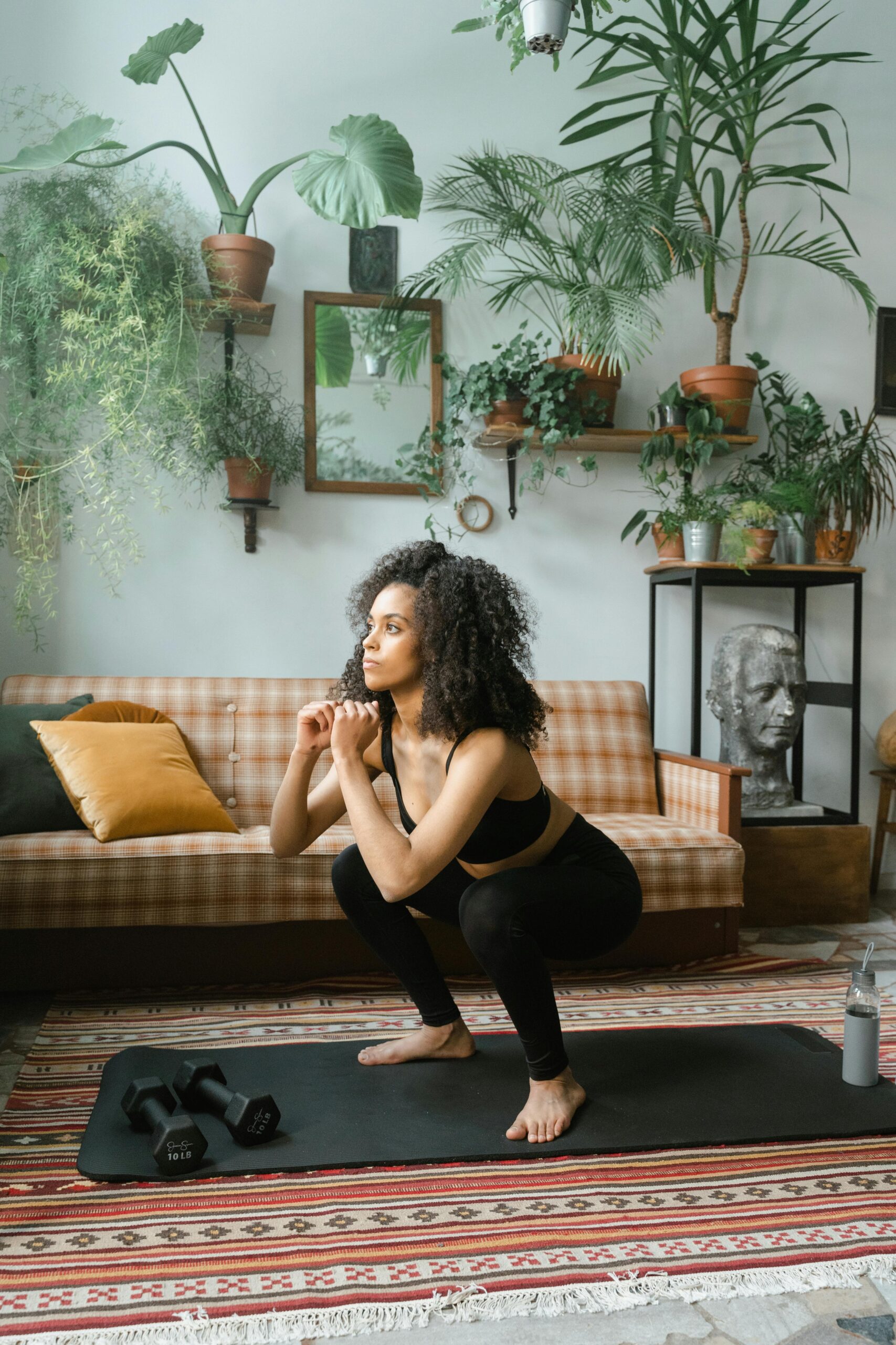 Woman performing a bodyweight squat at home