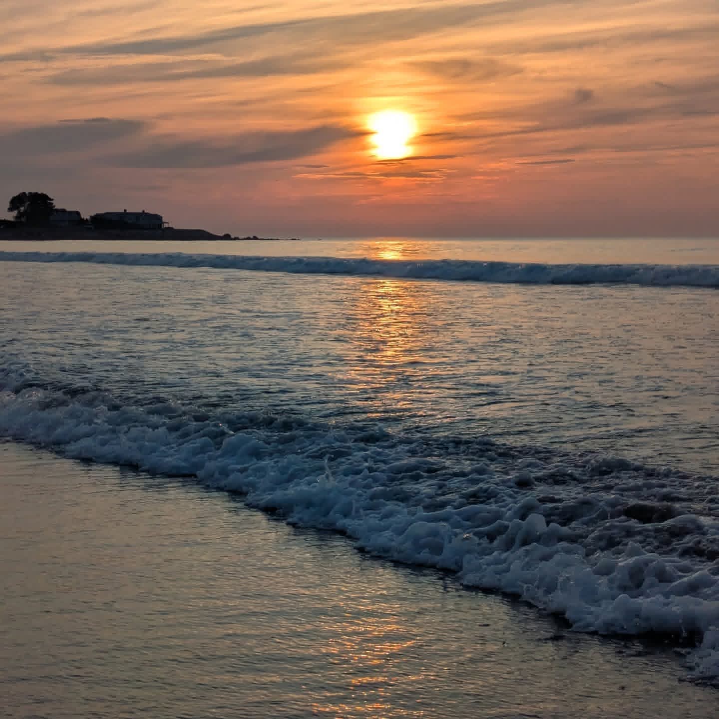 Sunset over the ocean at Misquamicut