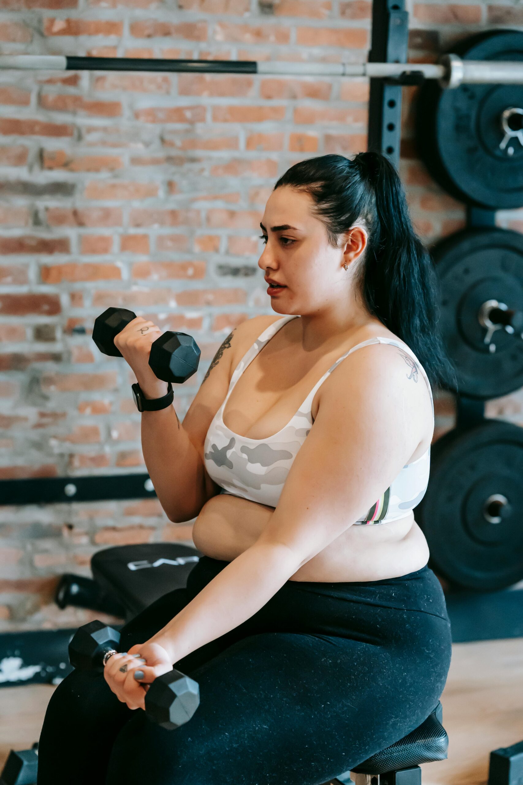 New mom doing gentle postpartum strength exercises