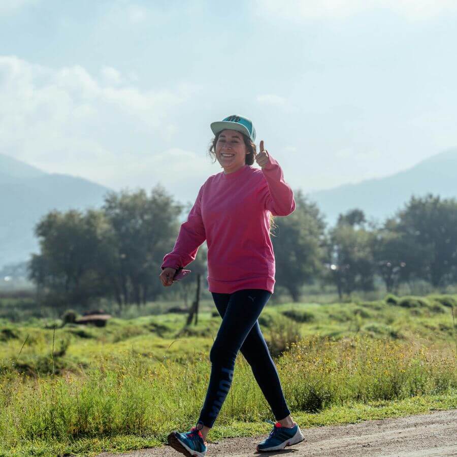 Woman over 40 doing brisk walking for low-impact cardio